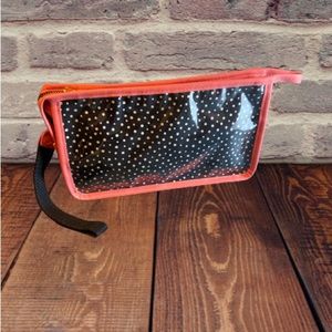 Black polka dot cosmetics bag.